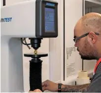  ??  ?? Metal compositio­n is analysed with a Rockwell hardness tester, which applies a pre-set load to a point on a sample part, the resultant dimple is measured afterwards. Pictured is a wheel nut being checked.