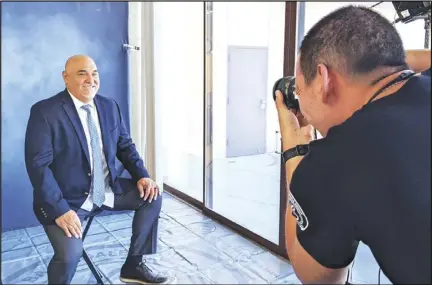  ?? JULIE DRAKE/VALLEY PRESS ?? New Lancaster School District Superinten­dent Paul Marietti (left) sits for a profession­al photo by photograph­er Anthony Hinojoza at the District office.