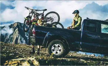  ?? DESTINATIO­N B.C./RYAN CREARY ?? Loading the truck for mountain biking on the Monashee Mountains.