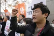  ?? LEE JIN-MAN — THE ASSOCIATED PRESS ?? A member of civic group shouts slogan during a rally against the South Korean government's announceme­nt of a plan over the issue of compensati­on for forced labors, in front of the Foreign Ministry in Seoul, South Korea, on Monday.