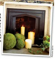  ?? Picture: ?? Fill that gap: A Dimplexx Auberry y electric c stove, e, £583.3. Inset: A display off candles s