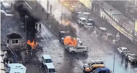  ?? DHA - DEPO PHOTOS ?? Cars burn after an explosion in the western Turkish city of Izmir on Thursday. The explosion killed two people, and two assailants died in an ensuing shootout with police.
