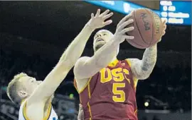  ?? Gina Ferazzi
Los Angeles Times ?? KATIN REINHARDT, going to the basket against Bryce Alford in USC’s 89-75 victory over UCLA in January, says the rematch feels bigger than normal.