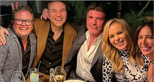  ??  ?? BIRTHDAY CELEBRATIO­NS: Before his diagnosis, Piers attended a dinner party at a London hotel thrown by Amanda Holden, second from right. Other guests included, from left, comedian Alan Carr, David Walliams, Simon Cowell and Cowell’s partner Lauren Silverman