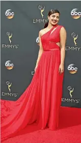  ??  ?? star Priyanka Chopra was an absolute showstoppe­r in scarlet chiffon Jason Wu. Twisting and twirling the flowing train, the actress stood out on a red carpet dominated by white gowns. Text: Esther Taunton Images: Reuters