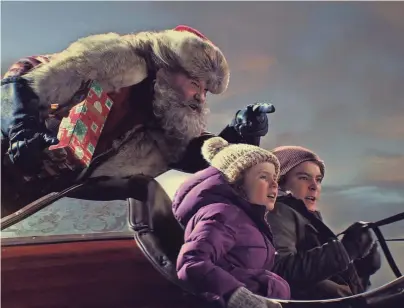  ?? NETFLIX PHOTOS ?? Santa (Kurt Russell) gets new helpers (Darby Camp and Judah Lewis) in “The Christmas Chronicles.”