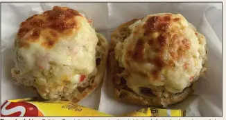  ?? (Arkansas Democrat-Gazette/Eric E. Harrison) ?? The crab salad from Delicious Temptation­s has quasi-crab surimi, instead of actual crab meat, mounded on two halves of an English muffin and topped with melted provolone.