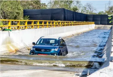  ??  ?? Thought going through water was big no, no in an EV? Here’s the Tata Nexon EV wading water effortless­ly