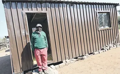  ?? Picture: Elvis Tshikhudo ?? TIN HOUSE. One of the 40 shacks that were handed over to poor people in Tzaneen, Limpopo, at the weekend. The temporary structures have been described as an insult to the poor.