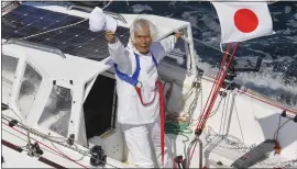  ?? KYODO NEWS VIA AP ?? Japan's Kenichi Horie waves after his trans-Pacific voyage, at Osaka Bay, western Japan, on Saturday. The 83-year-old completed his nonstop voyage that began in San Francisco.