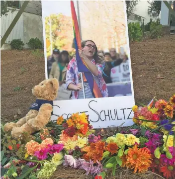  ??  ?? Georgia Tech students and faculty began placing flowers and notes in memory of slain Pride Alliance President Scout Schultz the day after they were killed. (Photo by Patrick Saunders)