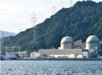  ??  ?? The Pacific Egret cargo vessel, left, carrying MOX, a mixture of plutonium and uranium fuel, arrives at Takahama nuclear power plant in Takahama, western Japan on September 21, 2017.—AP file