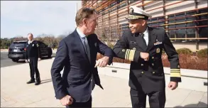  ?? Jessica Hill / Associated Press file photo ?? U.S. Surgeon General Vice Admiral Jerome M. Adams, right, bumped elbows with Gov. Ned Lamont in early March, before face mask protocols were set. Lamont on Thursday announced the city of New London is the state’s latest COVID-19 hot spot.