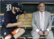  ?? CARLOS OSORIO — THE ASSOCIATED PRESS ?? In this May 19 photo, Detroit Tigers’ Alex Avila, left, shares a laugh with his father, general manager Al Avila during an interview in the dugout in Detroit. Al strives to strike a balance between business and personal with his son, Alex, who plays...