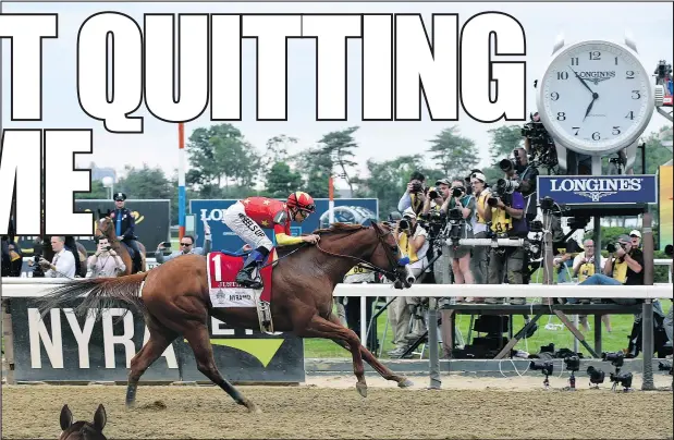  ?? Diane Bondareff/AP ?? Justify, ridden by Mike Smith, wins the Triple Crown and the 150th running of the Belmont Stakes on Saturday. The horse will take some time off before racing again later this summer. Below, trainer Bob Baffert and Justify take a stroll.