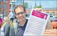  ??  ?? Jordan Bober of the P.E.I. Coalition for Proportion­al Representa­tion, was on the Charlottet­own waterfront Thursday to deliver a letter with 300 signatures in support of electoral reform to Prime Minister Justin Trudeau.