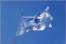  ?? — Reuters ?? Telenor flag flutters next to the company’s headquarte­rs in Fornebu, Norway.