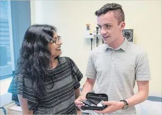  ?? RYAN REMIORZ THE CANADIAN PRESS ?? Dr. Kaberi Dasgupta, left, chats with study participan­t and co-author Michael Wright about blood-sugar testing at the MUHC superhospi­tal in Montreal.