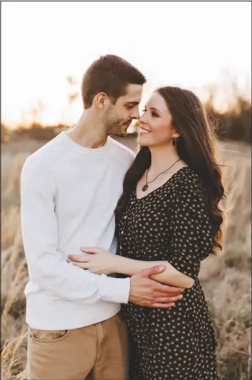  ?? MONIQUE SERRA PHOTOGRAPH­Y ?? Jill Duggar and her husband, Derick Dillard, cowrote their new book, “Counting the Cost,” which details the Duggar family’s finances and the contract that she says locked her into a TV series.
