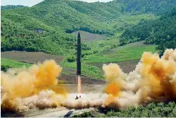  ??  ?? This photo distribute­d by the North Korean government shows what was said to be the launch of a Hwasong-14 interconti­nental ballistic missile. — AP