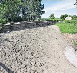  ?? ?? The highways agency poured concrete under the Victorian era Great Musgrave Bridge in Cumbria