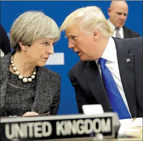  ?? AP/MATT DUNHAM ?? President Donald Trump talks to British Prime Minister Theresa May during a working dinner Thursday at NATO’s new headquarte­rs in Brussels. In remarks primarily about NATO members’ financial commitment­s, Trump said the U.S. would “never forsake the...