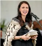  ??  ?? Above: Ratana Church, Te Haahi Ratana, during centenary celebratio­ns yesterday. This year marks 100 years since prophet Tahupotiki Wiremu Ratana is said to have received a divine revelation from which the church was born.Left: Prime Minister Jacinda Ardern gifted a Bible that was given to her by her mother, which contained her handwritte­n notes throughout.