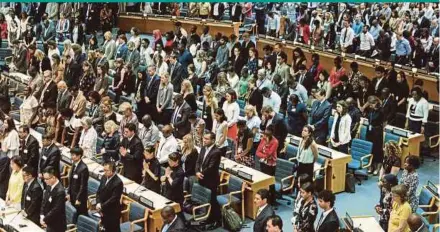  ?? AGENCY PIX ?? Delegates at the United Nations Environmen­t Programme observing a moment of silence for victims of Ethiopian Airlines Flight ET 302 in Nairobi yesterday.