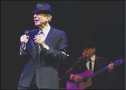  ?? AP PHOTO ?? Leonard Cohen performs during the Coachella Valley Music &amp; Arts Festival in Indio, Calif. Cohen’s family announced on Monday that a tribute concert for the late singer-songwriter will be held in Montreal on Nov. 6, a day before the anniversar­y of his death.