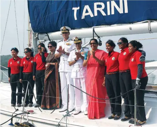  ?? PHOTOGRAPH: Indian Navy ?? Defence Minister Nirmala Sitharaman and Navy Chief Admiral Sunil Lanba with the Indian Navy’s six-member all-women crew who arrived in Panaji after circumnavi­gating the globe in over eight months on board the naval vessel INSV Tarini on May 21, 2018