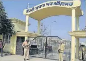  ?? HT PHOTO ?? Police personnel stand guard at the central jail in Amritsar.