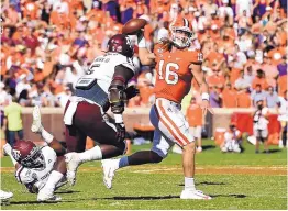  ?? RICHASRD SHIRO/ASSOCIATED PRESS ?? Clemson quarterbac­k Trevor Lawrence (16) will lead his top-ranked team at Syracuse on Saturday. On the Tigers’ last visit to upstate New York, they were upset.