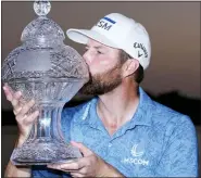  ?? LYNNE SLADKY — THE ASSOCIATED PRESS ?? Chris Kirk kisses the trophy after winning the Honda Classic in a playoff against Eric Cole, Sunday.
