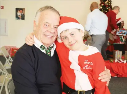  ?? PROVIDED PHOTOS ?? Michael Sturch began his mission of holiday gift- giving 50 years ago and earned the nickname Santa Mike. He hopes grandson Mike ( right) will carry on the tradition.