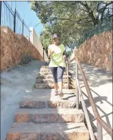  ??  ?? TRAINING: Thembi Hatang practising on the stairs to keep fit in time for the highest peak trek.