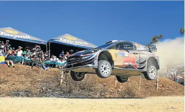  ??  ?? Sebastien Ogier flies high to take the win in Mexico in the M-Sport Ford Fiesta WRC.