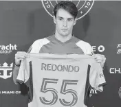  ?? MATIAS J. OCNER mocner@miamiheral­d.com ?? Federico Redondo holds his Inter Miami jersey Tuesday. The No. 55 is a homage to his father, former Real Madrid and AC Milan great Fernando Redondo, who wore No. 5.