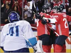  ?? AP PHOTO ?? Canada’s Steven Stamkos (91) celebrates his goal against Europe goalie Jaroslav Halak (left) with teammates Drew Doughty (8), Ryan Getzlaf and John Tavares (20) during the Game 1 of the World Cup of Hockey finals, Tuesday in Toronto.