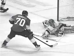  ?? MARTA LAVANDIER/AP ?? Kings goaltender Jonathan Quick, right, blocks a shot on goal by Panthers right wing Patric Hornqvist Thursday in Sunrise, Fla.