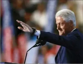  ?? PAUL SANCYA — THE ASSOCIATED PRESS ?? Former President Bill Clinton waves as he takes to the podium during the second day of the Democratic National Convention in Philadelph­ia Tuesday.