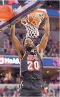  ?? NICK WASS/ASSOCIATED PRESS ?? Miami forward Justise Winslow gets a slam during the Heat’s victory over the Wizards in Washington.