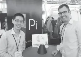  ?? AFP PHOTO ?? Pi co-founders Lixin Shi (left) and John MacDonald pose for a picture at a TechCrunch Disrupt technology conference in San Francisco on September 18, 2017 with the world’s first wireless charger that does away with the need to lay devices on charging...