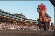  ?? Skip Dickstein / Associated Press ?? Authentic with jockey John Velazquez wins the Breeders Cup Classic at Keeneland Race Course on Saturday in Lexington, Ky.