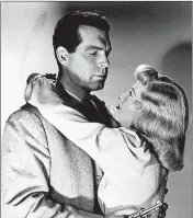  ?? TURNER CLASSIC MOVIES ?? Fred MacMurray feels the squeeze from Barbara Stanwyck in “Double Indemnity.”