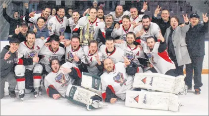  ?? MATT MOLLOY/SALTWIRE NETWORK ?? The Clarenvill­e Caribous celebrate their second straight Central West Senior Hockey League championsh­ip after defeating the Gander Flyers in Game 5 at the Steele Coimmunity Centre in Gander.