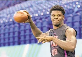  ?? GREGORY PAYAN/ASSOCIATED PRESS ?? Louisville quarterbac­k Lamar Jackson has drawn comparison­s to Michael Vick because of his sensationa­l running ability. The Ravens had him in for a visit recently.