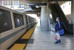  ?? RAY CHAVEZ — STAFF PHOTOGRAPH­ER ?? Rosaura Moreno waits for the train to stop to board at the North Concord/ Martinez BART station in Concord on Jan. 28.