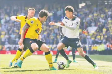  ??  ?? Tottenham’s Dele Alli (right) in action with Watford’s Daryl Janmaat and Tom Cleverley during the English Premier League match at White Hart Lane in this April 8 file photo. — Reuters photo