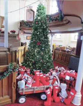  ?? SPECIAL TO THE EXAMINER ?? More than 100 Christmas stockings have been stuffed as part of the Stuff our Sox project at Emmanuel United Church. This is the 49th year for the project, which sees the stuffed socks delivered throughout the community where there is a need.