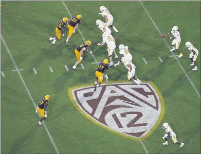  ?? RALPH FRESO — THE ASSOCIATED PRESS FILE ?? The Pac-12 logo is seen during the second half of an Aug. 29 game between Arizona State and Kent State in Tempe, Ariz.